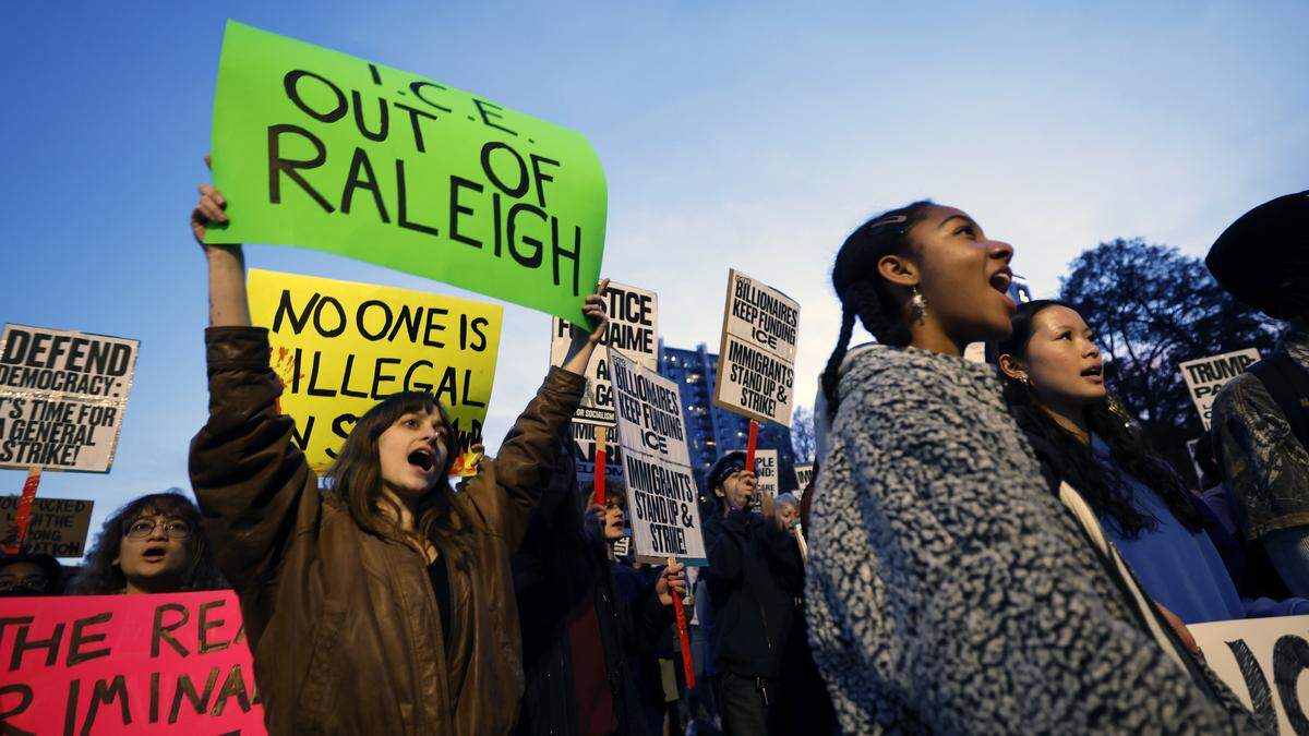 Lydia Read a N.C. state sophomore (left) and hundreds others gathered in Moore Square downtown Raleigh, N.C., Tuesday, Nov. 18, 2025 to protest Border Patrol agents making arrests in the area.