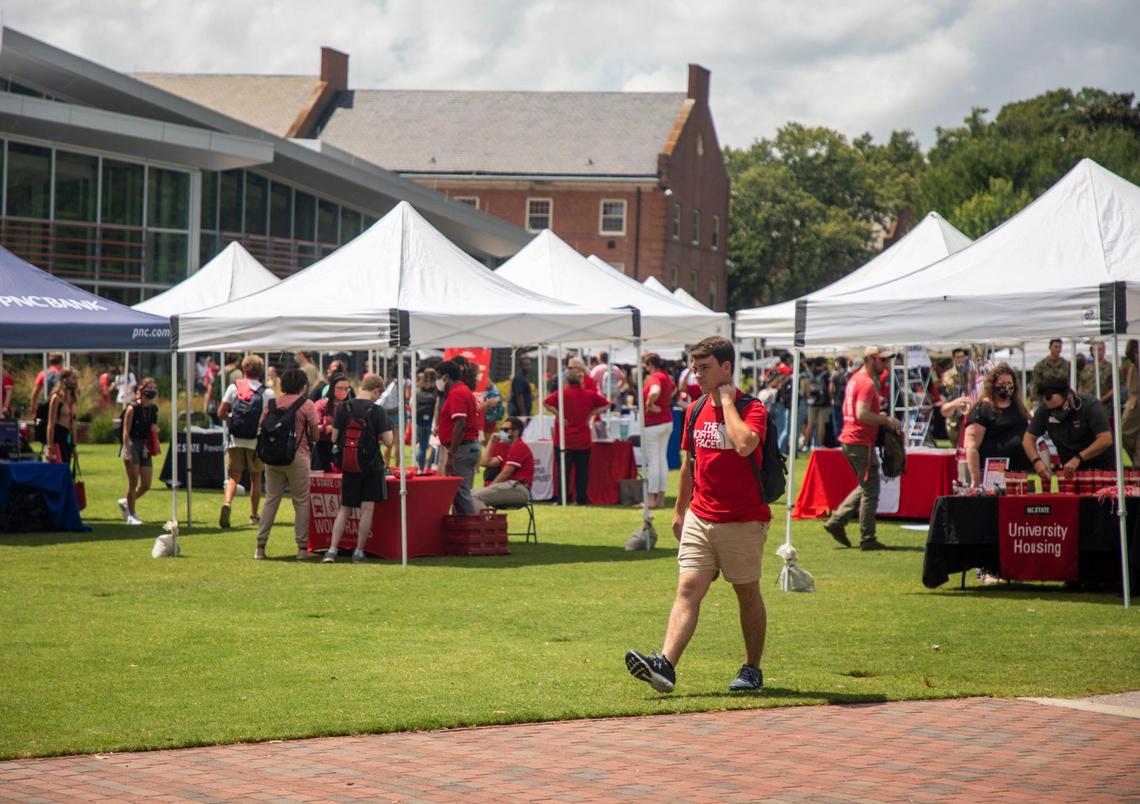 The lawn outside the Talley Student Union at N.C. State fills with tents and students on the first day of classes for the fall semester, on Monday, Aug. 16, 2021, in Raleigh, N.C.