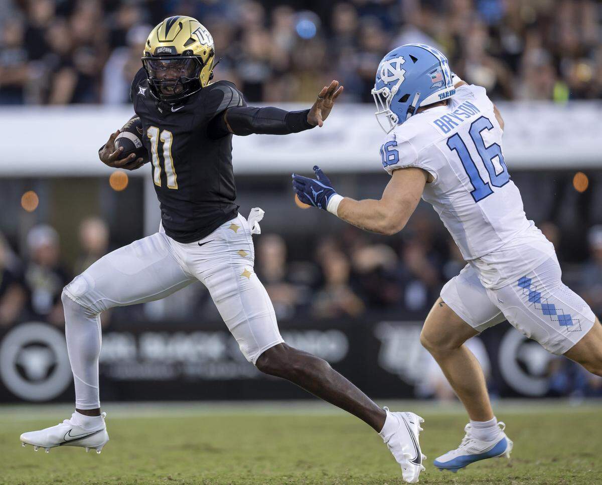 UCF quarterback Jacurri Brown (11) breaks open for a nine-yard gain ahead of North Carolina nickel Coleman Bryson (16) in the fourth quarter on Saturday, September 20, 2025 at Acrisure Bounce House Stadium in Orlando, Fla.
