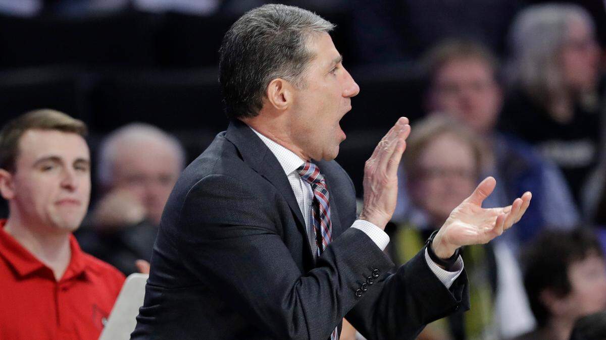 Louisville assistant coach Dino Gaudio cheers on his team against Wake Forest during a game in Winston-Salem, N.C., Wednesday, Jan. 30, 2019.
