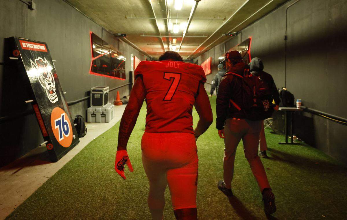 N.C. State’s Justin Joly walks up the tunnel after the Wolfpack’s final home game of the season, a 42-19 victory over UNC, at Carter-Finley Stadium Saturday, Nov. 29, 2025.
