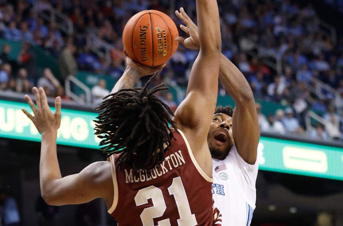 North Carolina’s Leaky Black (1) shoots as Boston College’s Devin McGlockton (21) defends during the first half of UNC’s game against Boston College in the second round of the New York Life ACC Men’s Basketball Tournament in Greensboro, N.C., Wednesday, March 8, 2023.