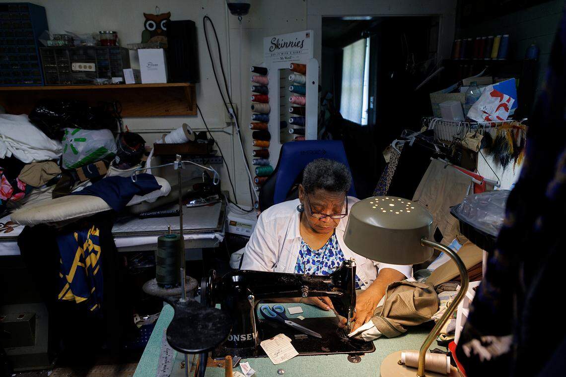Linda Laws, owner of Stitches Tailor Shop, works at the shop on Monday, July 15, 2024, in Durham, N.C. After 28 years at its current location on Hillsborough Road, Laws is preparing to relocate the business.