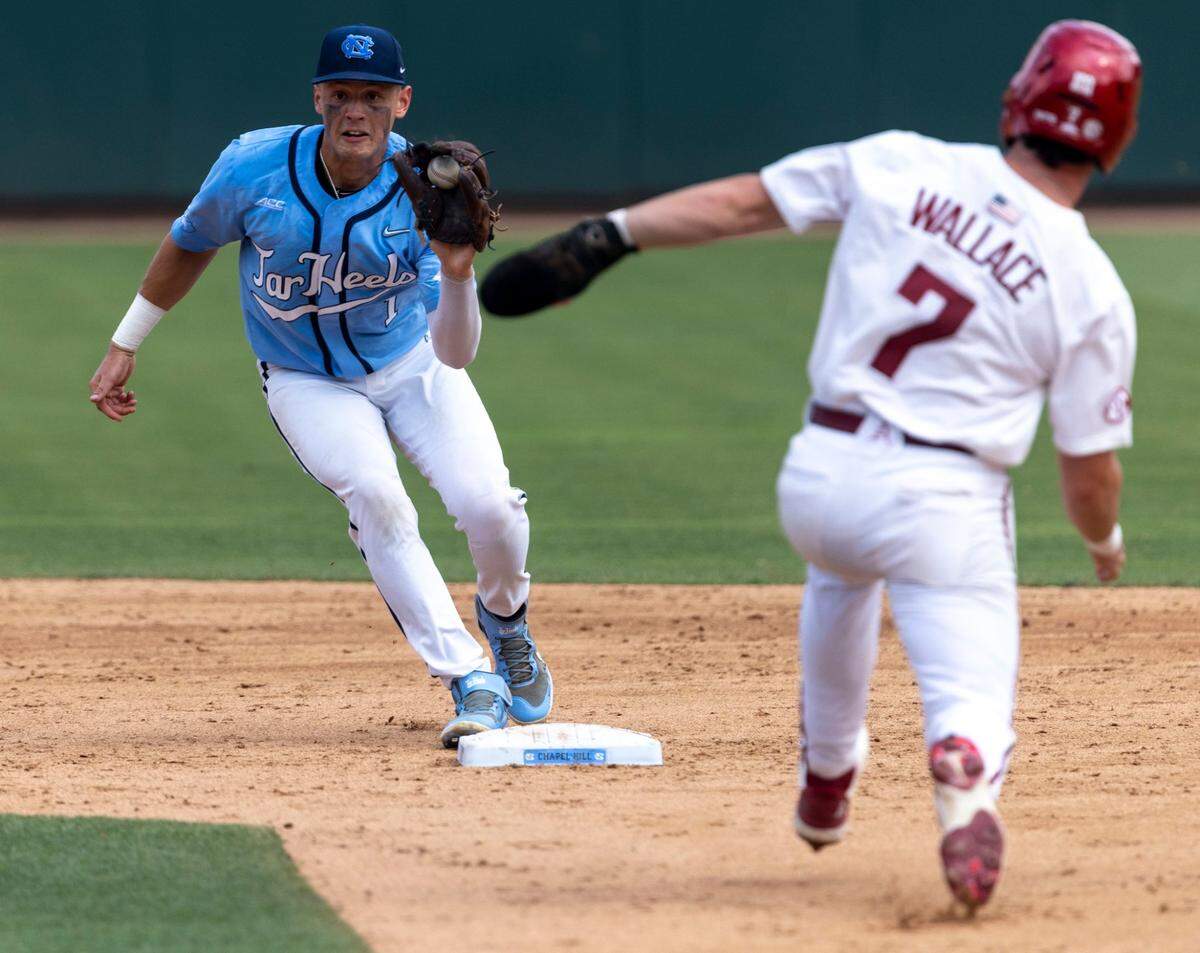 North Carolina short stop Danny Serretti (1) forces out Arkansas Cayden Wallace (7) at second base in the fifth inning during game two of their NCAA Super Regional series on Sunday, June 12, 2022 at Boshamer Stadium in Chapel Hill, N.C.