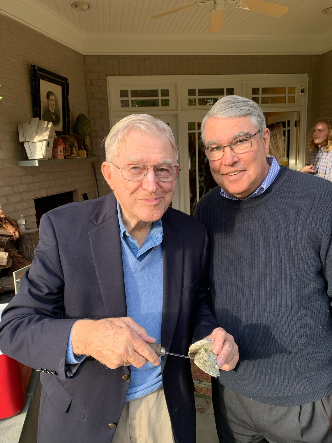Ford S. Worthy Jr. and his son Ford S. Worthy are pictured about two years ago, when the elder worthy was roughly 98. He is shown eating an oyster on the half shell.
