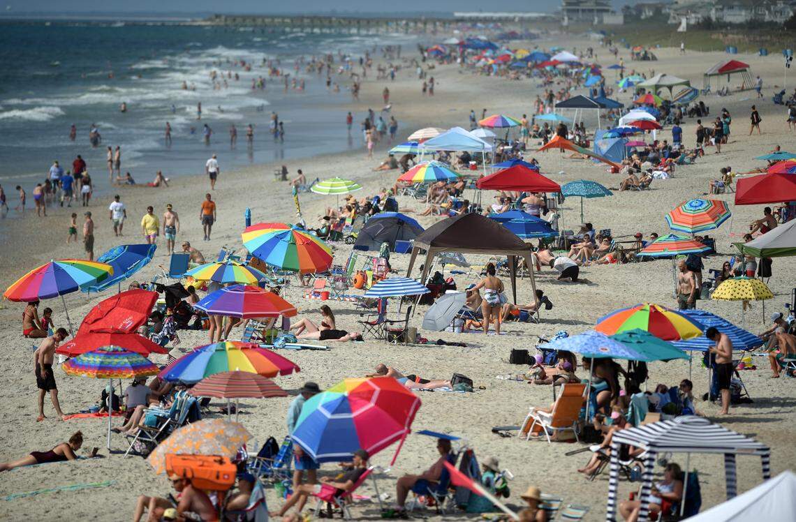 Crowds gathered south of Johnnie Mercer’s Fishing Pier in Wrightsville Beach, N.C., Saturday, May 25, 2019.  Memorial Day weekend marks the beginning of the busiest part of the beach and tourist season.