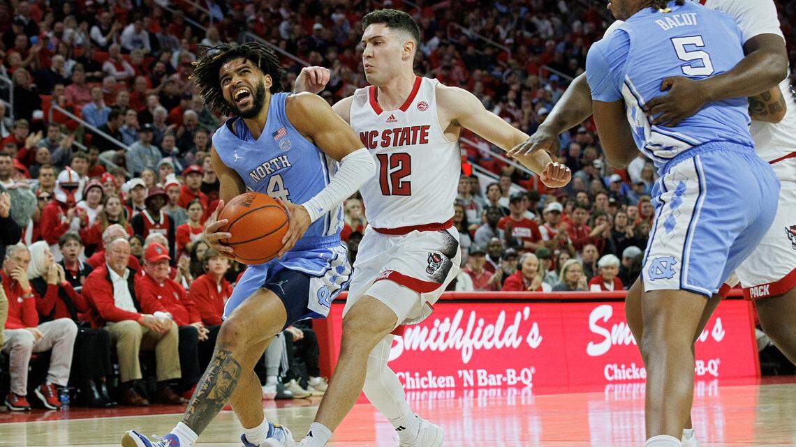 North Carolina’s RJ Davis drives to the basket past N.C. State’s Michael O’Connell during the first half of the Tar Heels’ 67-54 win at PNC Arena on Wednesday, Jan. 10, 2024, in Raleigh, N.C.