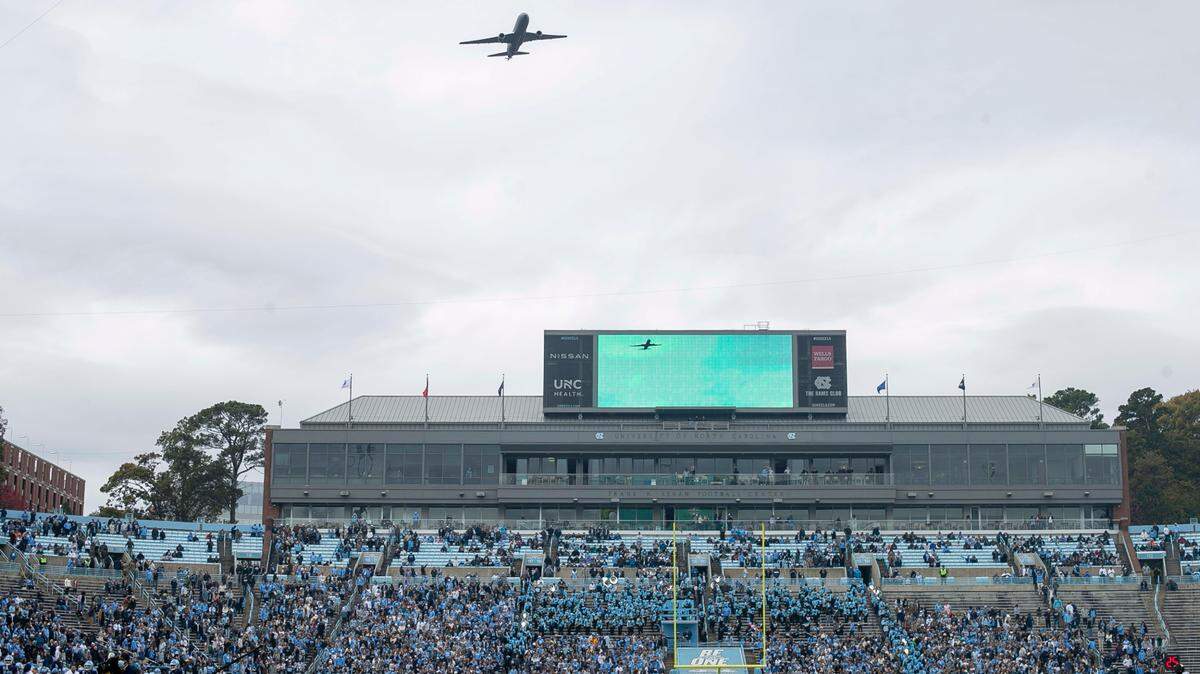 An Air Force Boeing KC-46 Pegasus aircraft passes over the University of North Carolina campus and Kenan Stadium prior to the kick off of the North Carolina vs. Wake Forest football game on Saturday, November 6, 2021 in Chapel Hill, N.C.
