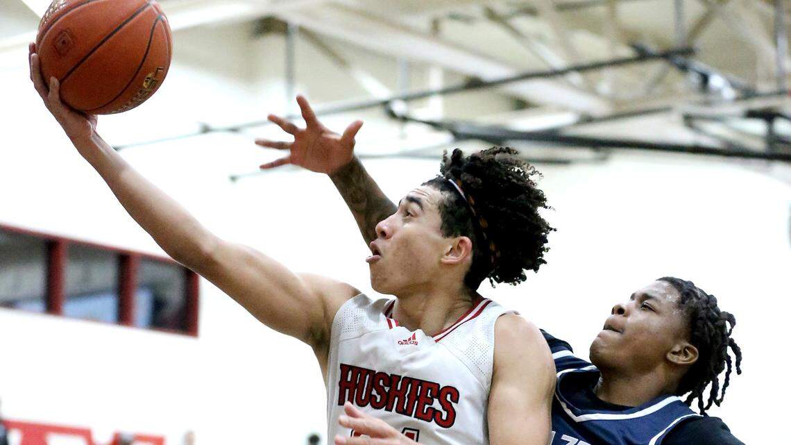 Centennial guard Jared McCain #24 flies to the hoop for a layup as Sierra Canyon guard Mike Price #5 defends in the second half of the CIF State Open Division boys basketball regional championship game in Corona on Tuesday, March 8, 2022.