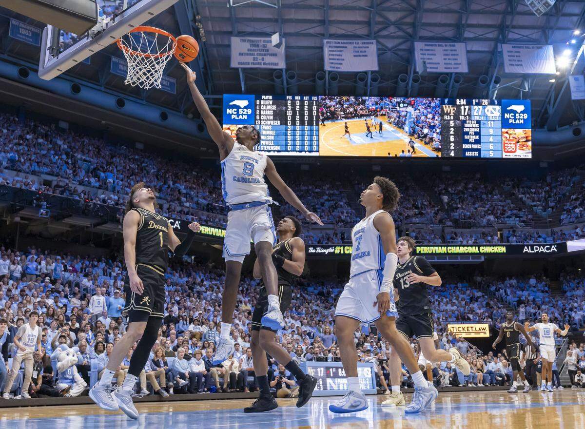 North Carolina forward Caleb Wilson (8) drives to the basket against Wake Forest guard Nate Calmese (1) in the first half on Saturday, January 10, 2026 at the Smith Center in Chapel Hill, N.C.