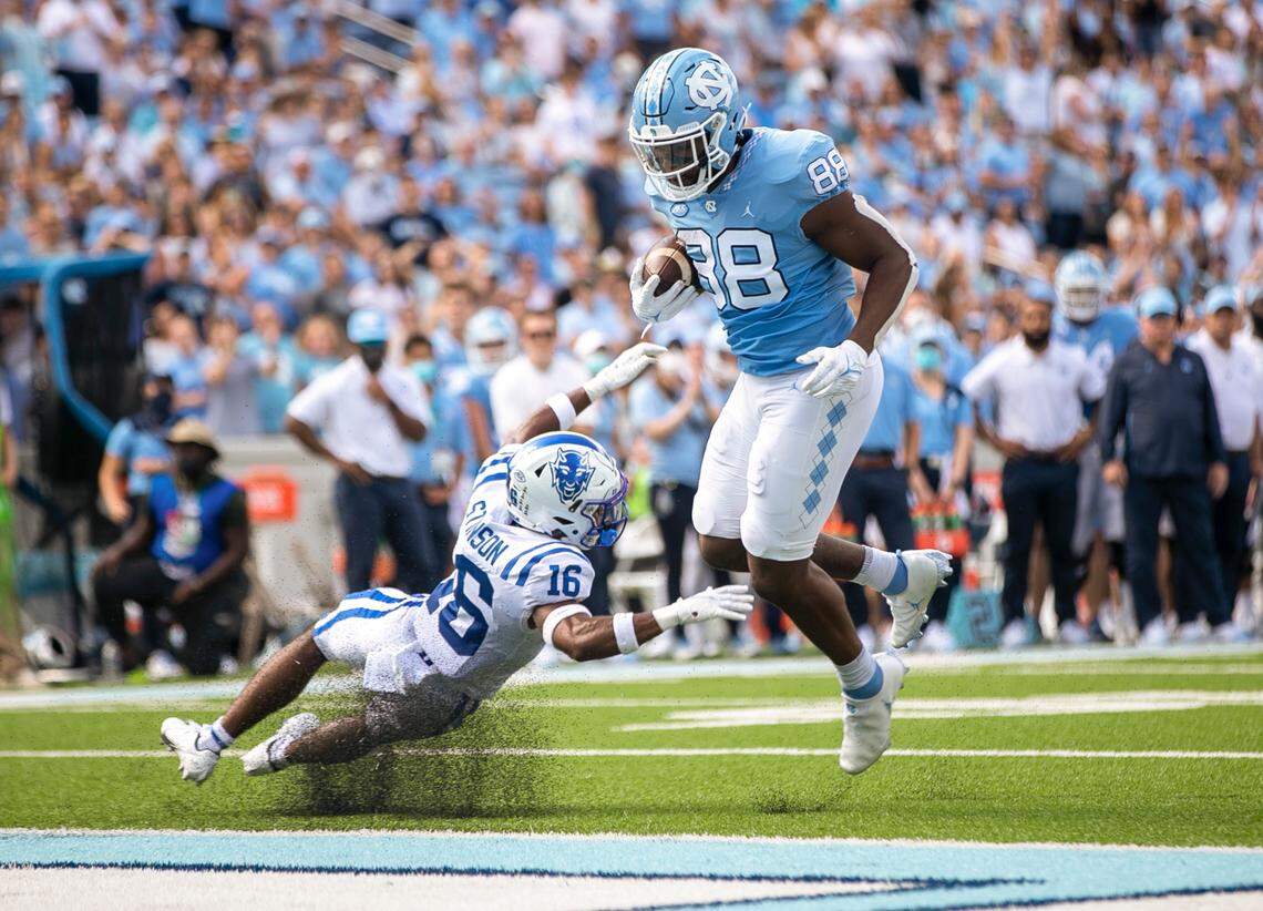 North Carolina’s Kamari Morales (88) scores on a 2-yard pass from quarterback Sam Howell (7) to give the Tar Heels’ a 21-0 lead over Duke in the second quarter on Saturday, October 2, 2021 at Kenan Stadium in Chapel Hill, N.C.