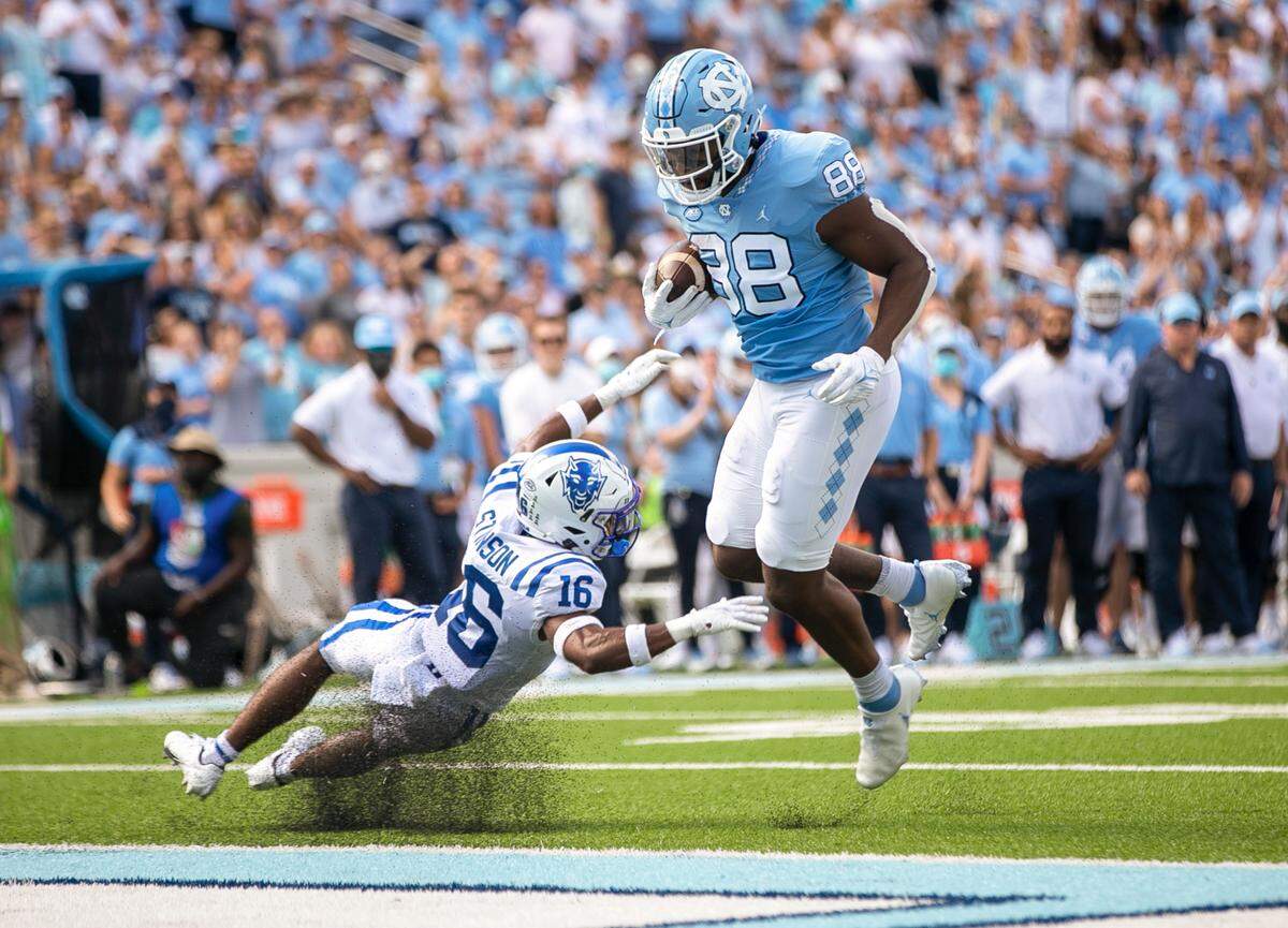 North Carolina’s Kamari Morales (88) scores on a 2-yard pass from quarterback Sam Howell (7) to give the Tar Heels’ a 21-0 lead over Duke in the second quarter on Saturday, October 2, 2021 at Kenan Stadium in Chapel Hill, N.C.