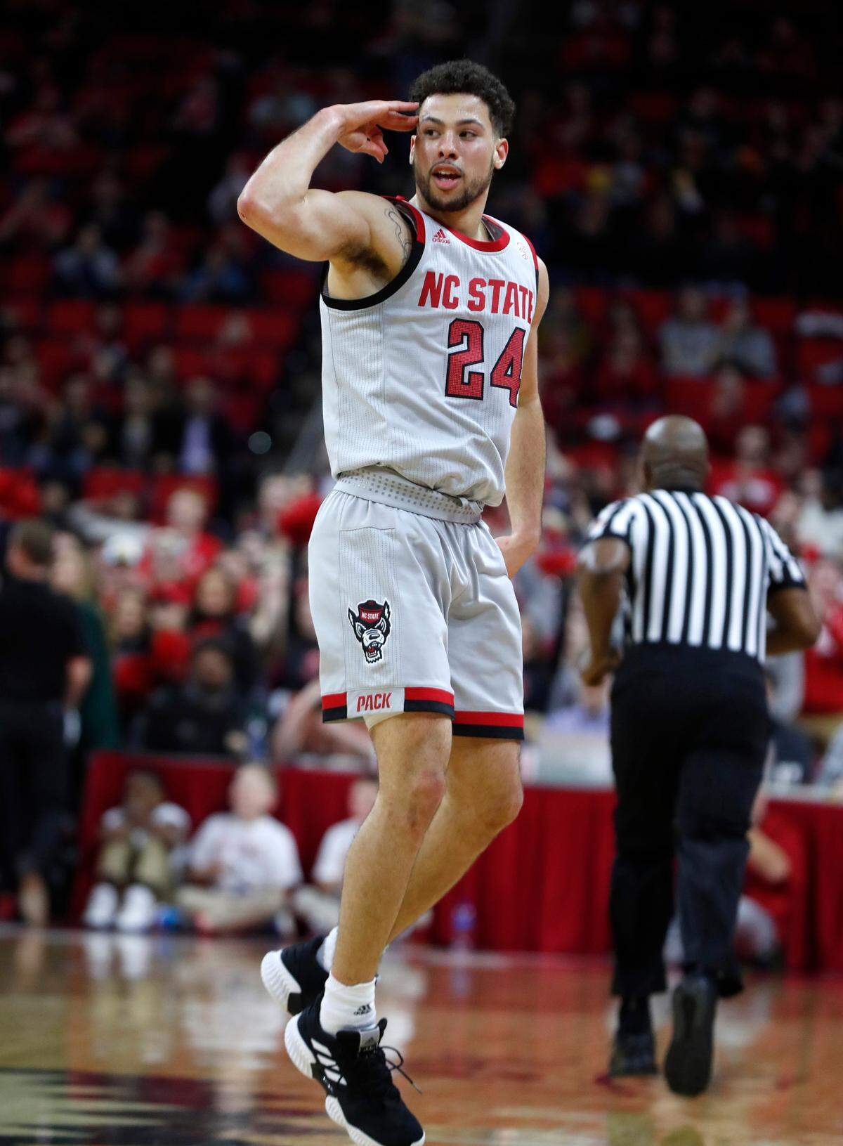 N.C. State’s Devon Daniels (24) celebrates making a three-pointer during the first half of N.C. State’s game against Boston College at PNC Arena in Raleigh, N.C., Wednesday, Feb. 20, 2019.