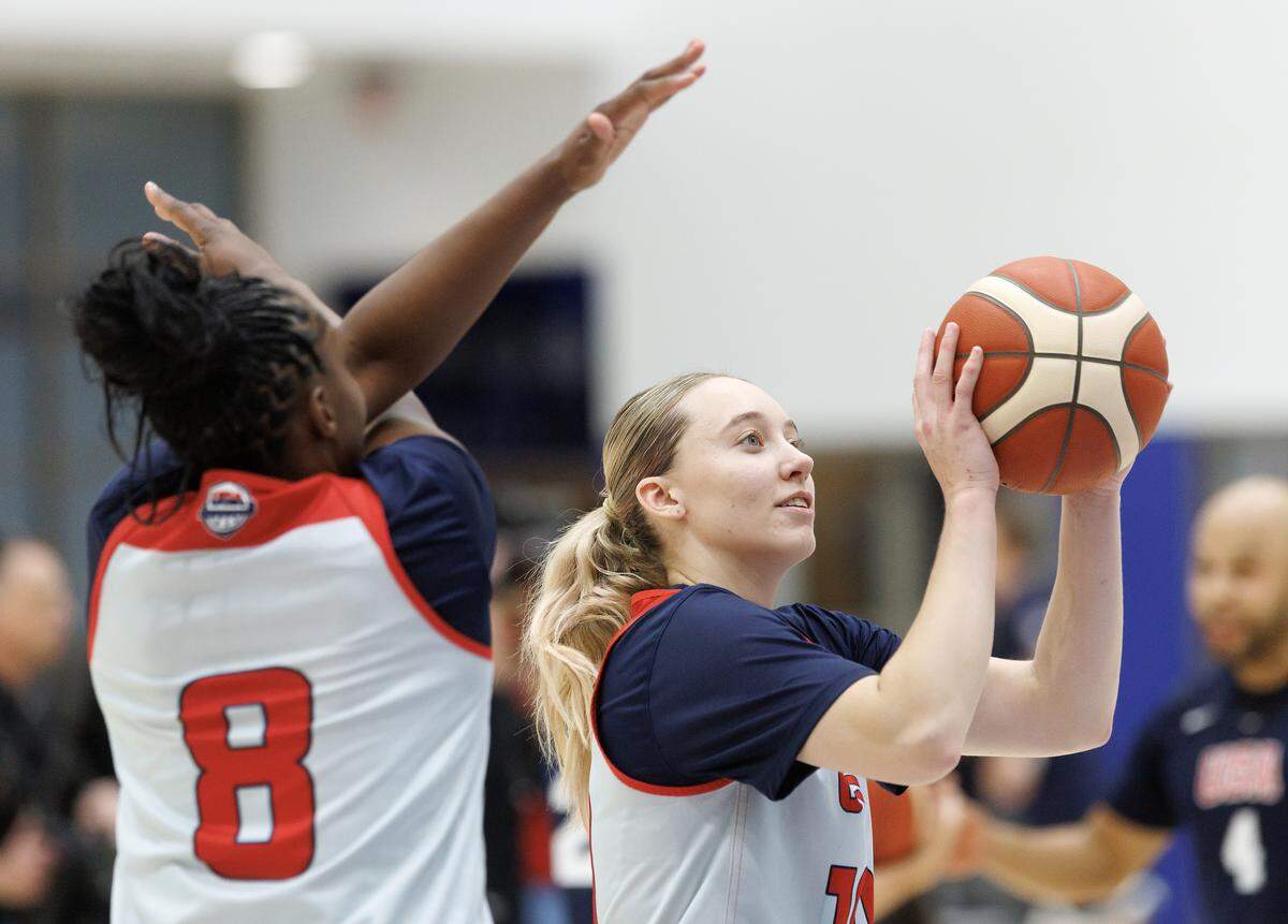 Chelsea Gray tries to distract Paige Bueckers as she shoots a free throw during USA Basketball Women’s National Team training camp on Friday, Dec. 12, 2025, in Durham, N.C.