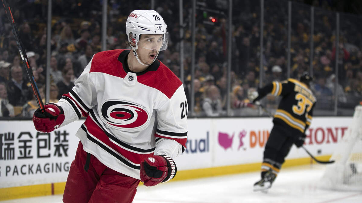 Carolina Hurricanes’ Sebastian Aho (20) celebrates after scoring on Boston Bruins’ goalie Tuukka Rask (40) to tie the score 1-1 during the first period in Game One of the Eastern Conference finals on Thursday.