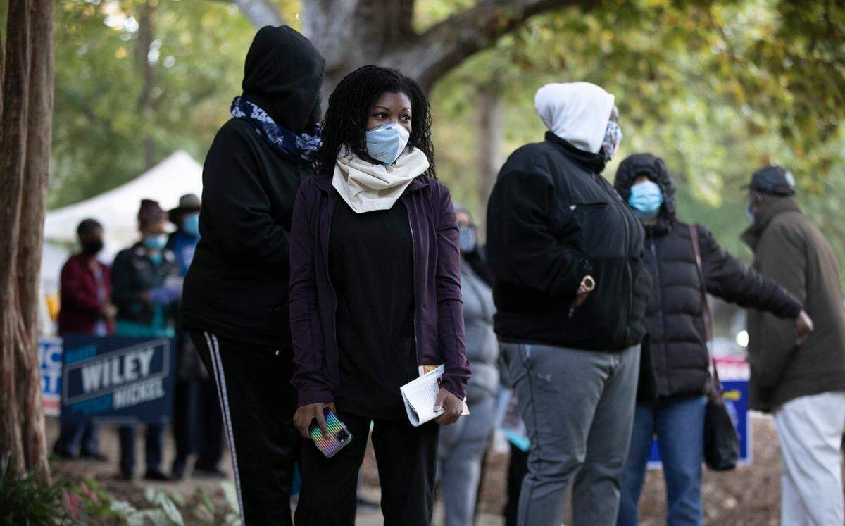 Jules Morris was the first person in line to vote at Robert’s Park on Martin Street. She arrived at 4:45 a.m. By the time the poll opened at 8 a.m. more than 350 people had joined her in a line that wrapped around the community center. ‘I don’t think there any anything more important that democracy’, Morris said as he entered to vote on Thursday, October 15, 2020 in Raleigh, N.C.