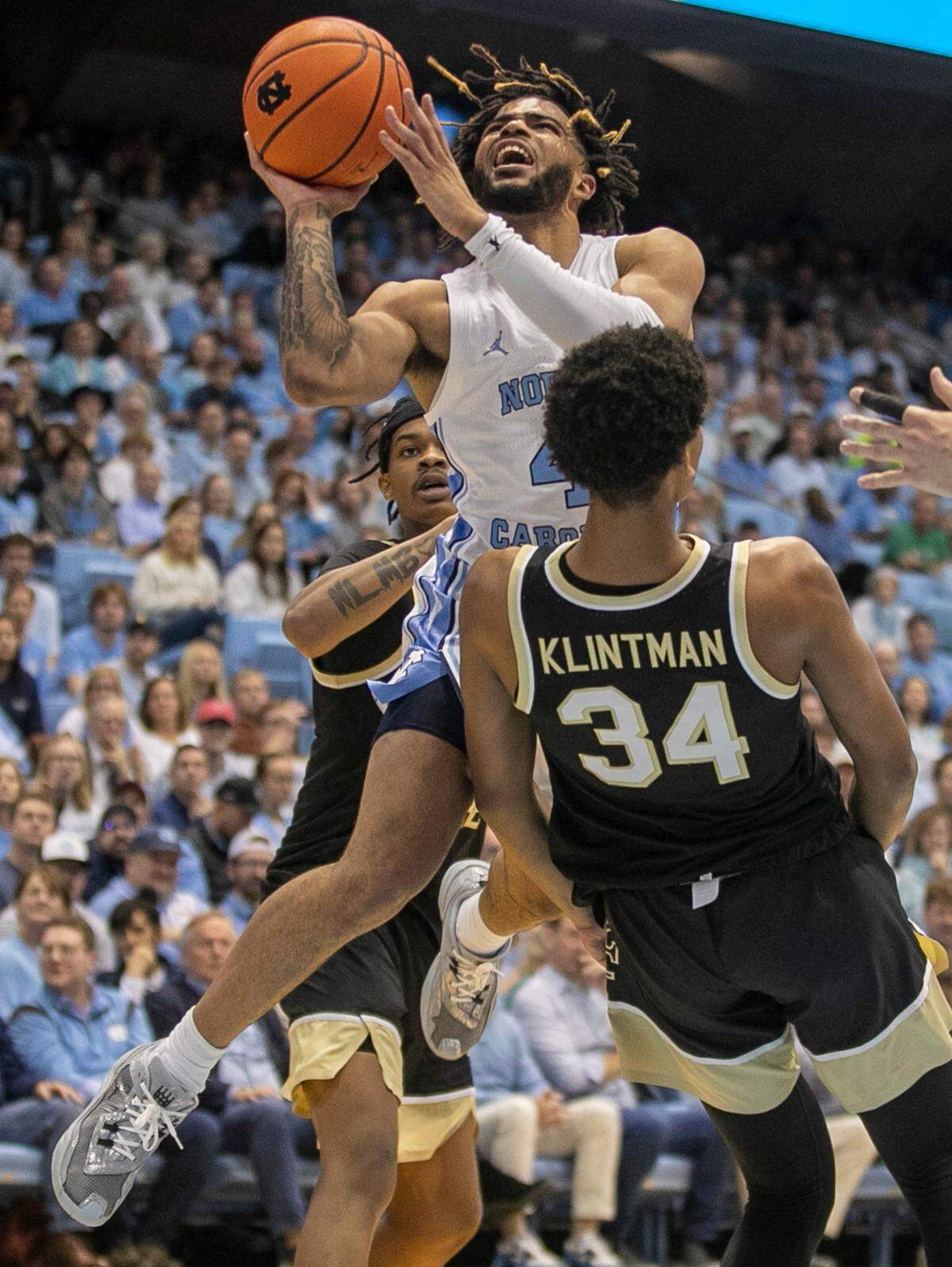 North Carolina’s R.J. Davis (4) drives to the basket against Wake Forest’s Bobi Klintman (34) in the first half on Wednesday, January 4, 2023 at the Smith Center in Chapel Hill, N.C. Davis lead North Carolina with 27 points in their 88-79 victory.