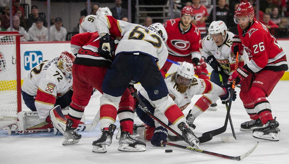 The Florida Panthers Marc Staal (18) goes after the puck under the Carolina Hurricanes Jesper Fast (71) and Paul Stastny (26) in the third period during Game 2 of the Eastern Conference Finals on Saturday, May 20, 2023 at PNC Arena in Raleigh, N.C.