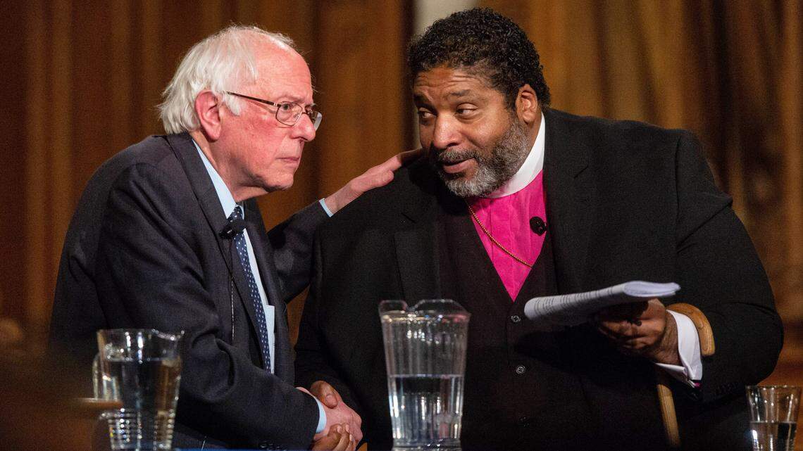 U.S. Sen. Bernie Sanders, left, and the Rev. William J. Barber II participate in a public forum Thursday at Duke Chapel in Durham.