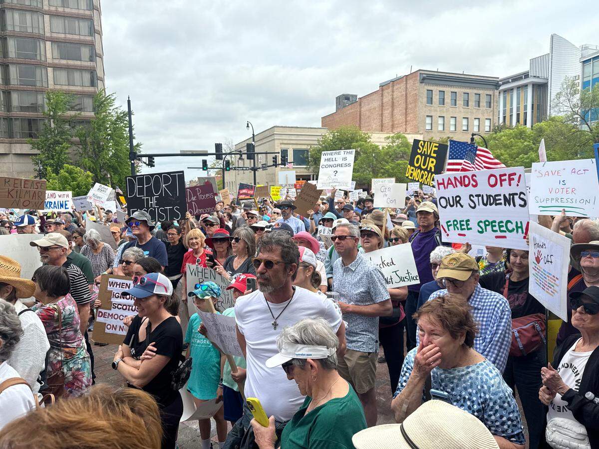 More than 1,000 people gathered at CCB Plaza in Durham Saturday, one of a dozen protests across North Carolina against Trump administration policies.