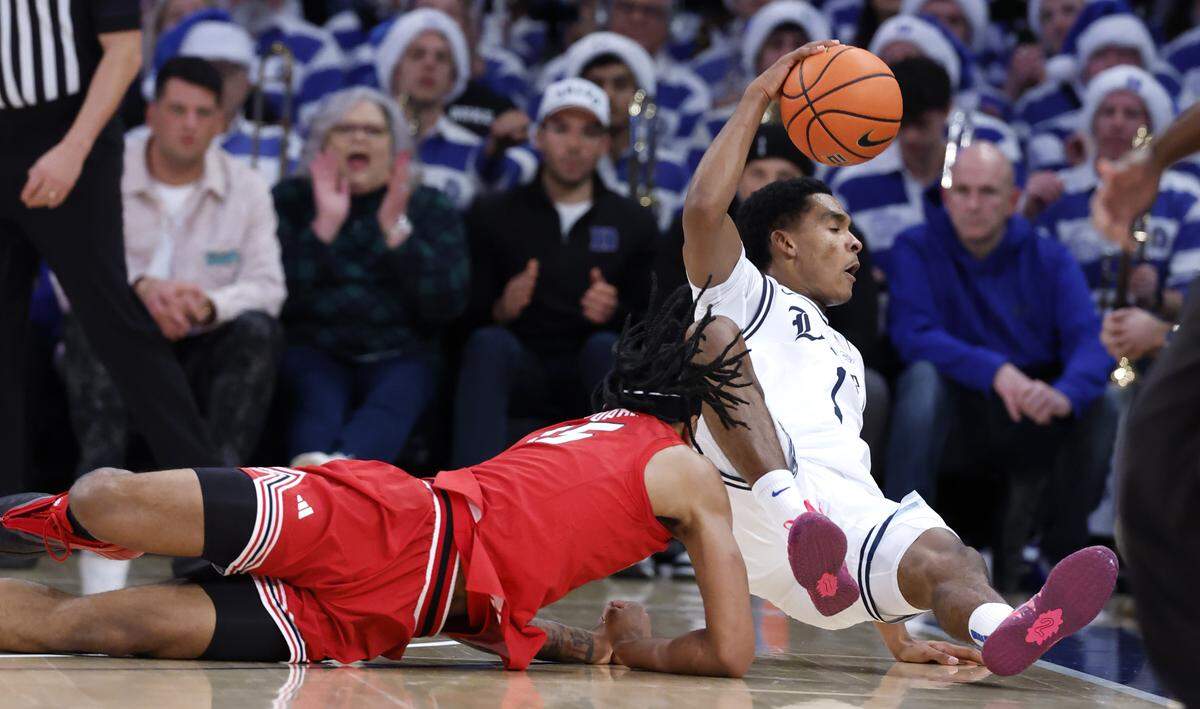 Duke’s Caleb Foster (1) is fouled by Texas Tech's JT Toppin (15) as he goes after the ball during the first half of Duke’s game against Texas Tech in the SentinelOne Classic at Madison Square Garden in New York City, N.Y., Saturday, Dec. 20, 2025.