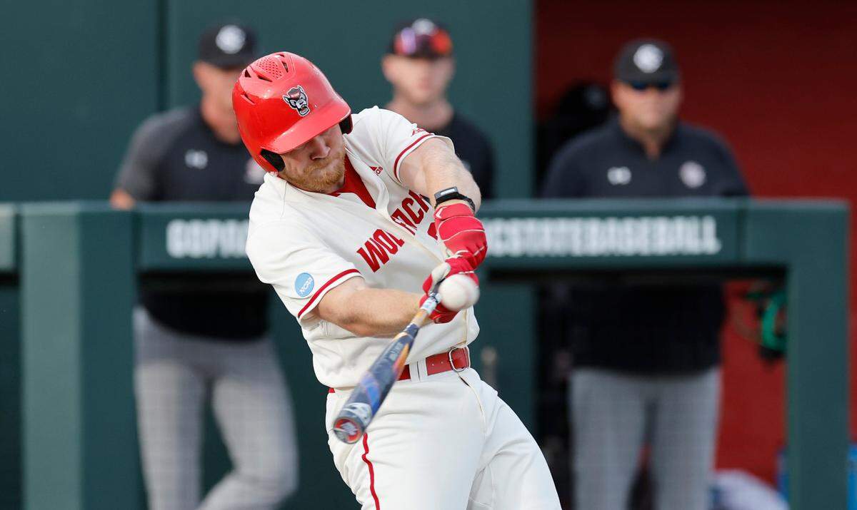 N.C. State’s Garrett Pennington (33) connects on a two-run home run in the third inning during N.C. State’s game against South Carolina in the NCAA Raleigh Regional at Doak Field Saturday, June 1, 2024.