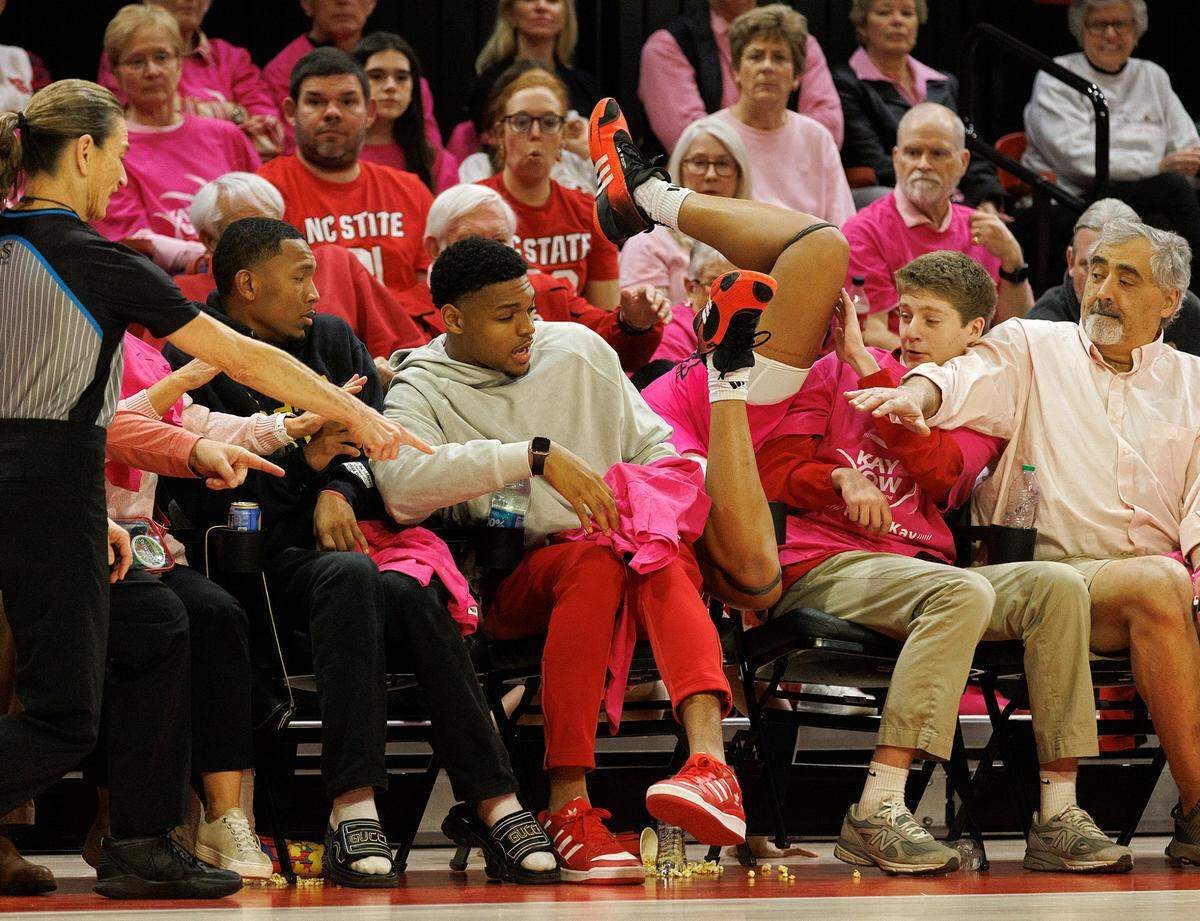 Louisville’s Nyla Harris dives into the crowd during the first half of the Wolfpack’s 77-67 win on Monday, Feb. 5, 2024, at Reynolds Coliseum in Raleigh, N.C.