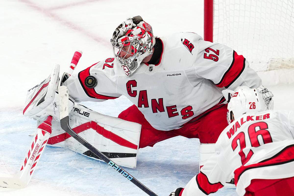 Carolina Hurricanes goaltender Pyotr Kochetkov (52) makes a save against the Vegas Golden Knights during the third period at T-Mobile Arena.