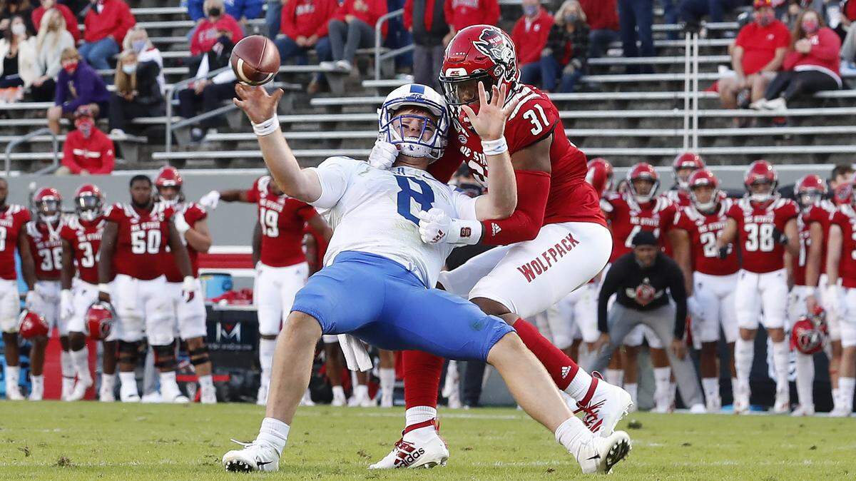 On fourth and goal from the one, N.C. State linebacker Vi Jones (31) chases down Duke quarterback Chase Brice (8) to cause an incompletion and turnover on downs during the second half of N.C. State’s 31-20 victory over Duke at Carter-Finley Stadium in Raleigh, N.C., Saturday, Oct. 17, 2020.
