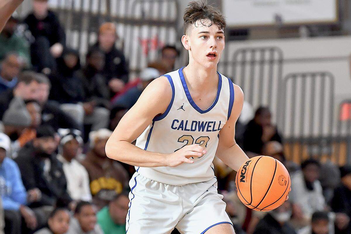 Caldwell Academy’s Cole Cloer (23) looks to size up the defense from Davidson Day during the second half of the John Wall Invitational Tournament.  The Davidson Day Patriots and the Caldwell Academy Eagles met in the John Wall Holiday Invitational Tournament in Raleigh, N.C. on December 26, 2024.