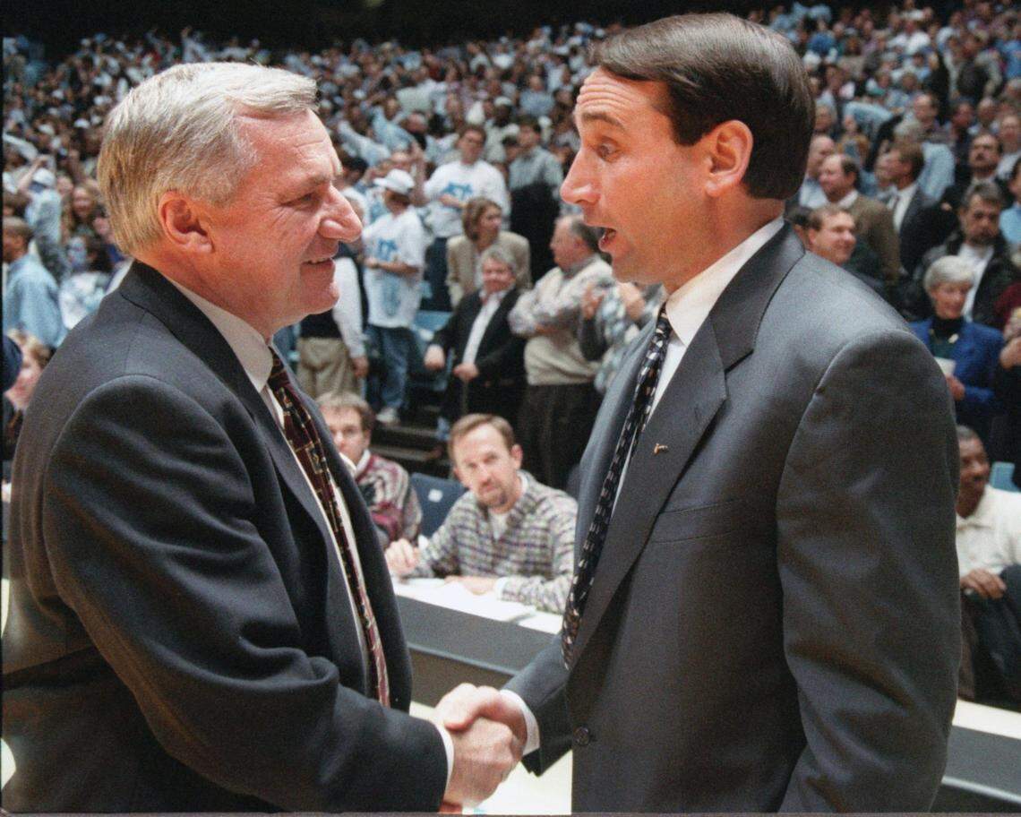 North Carolina coach Dean Smith and Duke coach Mike Krzyzewski shake hands before theur game,at UNC in 1996.