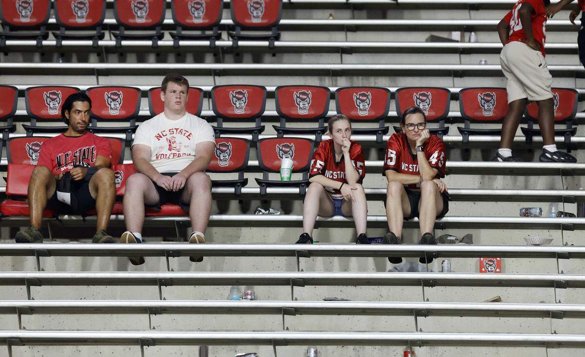 Wolfpack fans sit in the stands after Virginia TechÕs 23-21 victory over N.C. State at Carter-Finley Stadium in Raleigh, N.C., Saturday, Sept. 27, 2025.