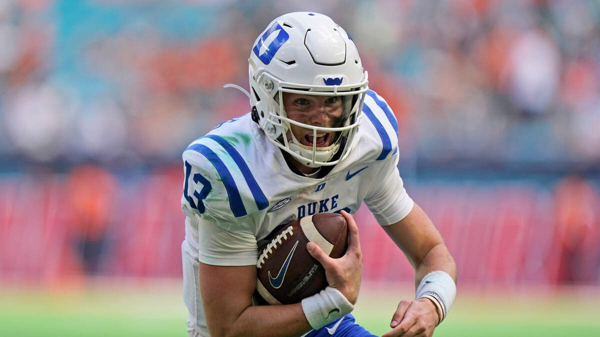 Duke quarterback Riley Leonard runs the ball in for a touchdown during the first half of an NCAA college football game against Miami, Saturday, Oct. 22, 2022, in Miami Gardens, Fla. (AP Photo/Wilfredo Lee)