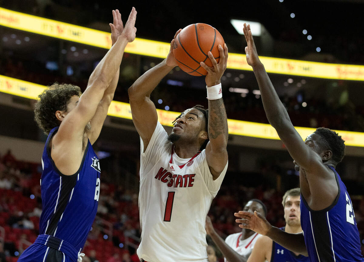 N.C. State’s Jayden Taylor splits the defense to drive to the basket during the second half of the Wolfpack’s 84-64 win over Abilene Christian on Friday, Nov. 10, 2023, at PNC Arena in Raleigh, N.C.