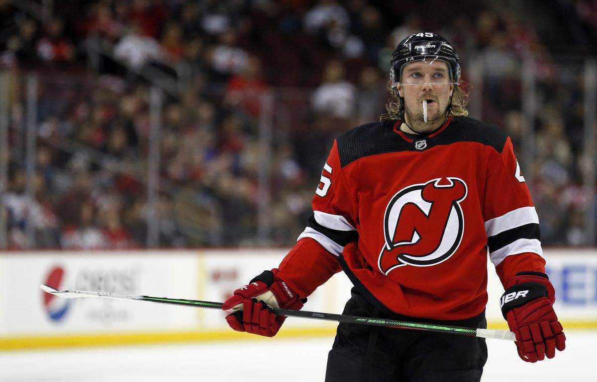 New Jersey Devils defenseman Sami Vatanen (45) during a break in action against the Tampa Bay Lightning during the third period of an NHL hockey game Sunday, Jan. 12, 2020, in Newark, N.J. The Devils won 3-1. (AP Photo/Adam Hunger)