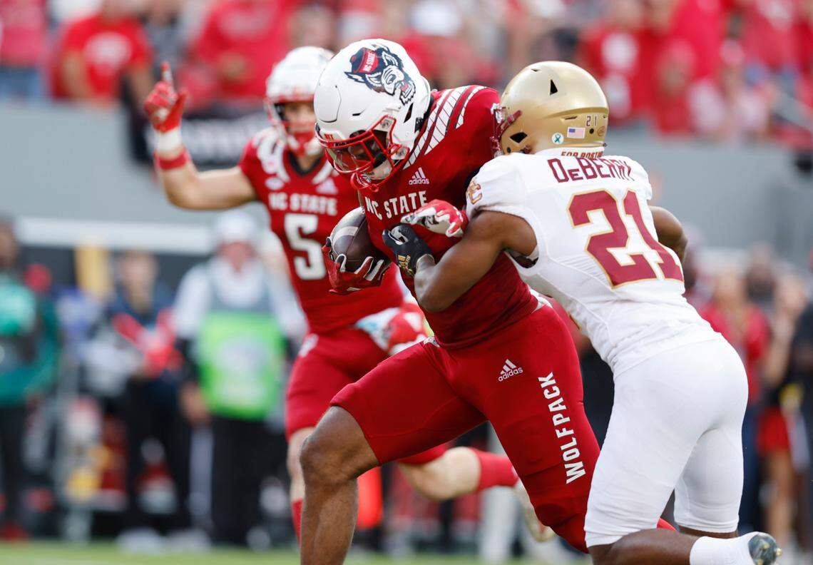 N.C. State’s Trent Pennix (6) gets by Boston College defensive back Josh DeBerry (21) to score on 27-yard touchdown reception during the first half of N.C. State’s game against Boston College at Carter-Finley Stadium in Raleigh, N.C., Saturday, Nov. 12, 2022.