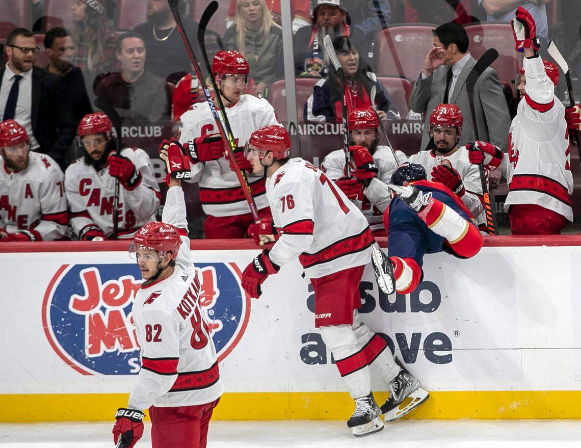 The Florida Panthers Colin White (6) is checked in the Carolina Hurricanes’ bench by Brady Skjei (76) in the third period of Game 3 during the Eastern Conference Finals on Monday, May 22, 2023 at FLA Live Arena in Sunrise, Fla.
