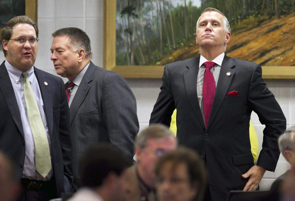 Speaker of the House, Thom Tillis stands in the back of the House chamber and listens to debate of Senate Bill 402, the Appropriations Act of 2013 on Wednesday July 24, 2013 at the North Carolina General Assembly in Raleigh, N.C.