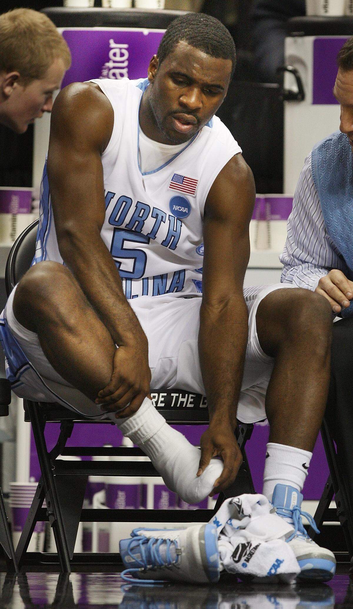 North Carolina guard Ty Lawson (5) checks his toes after a mid-court collision in the first half against LSU at the NCAA tournament in Greensboro,NC Saturday March 21, 2009. Lawson was out for a few minutes in obvious pain but re-entered the game.