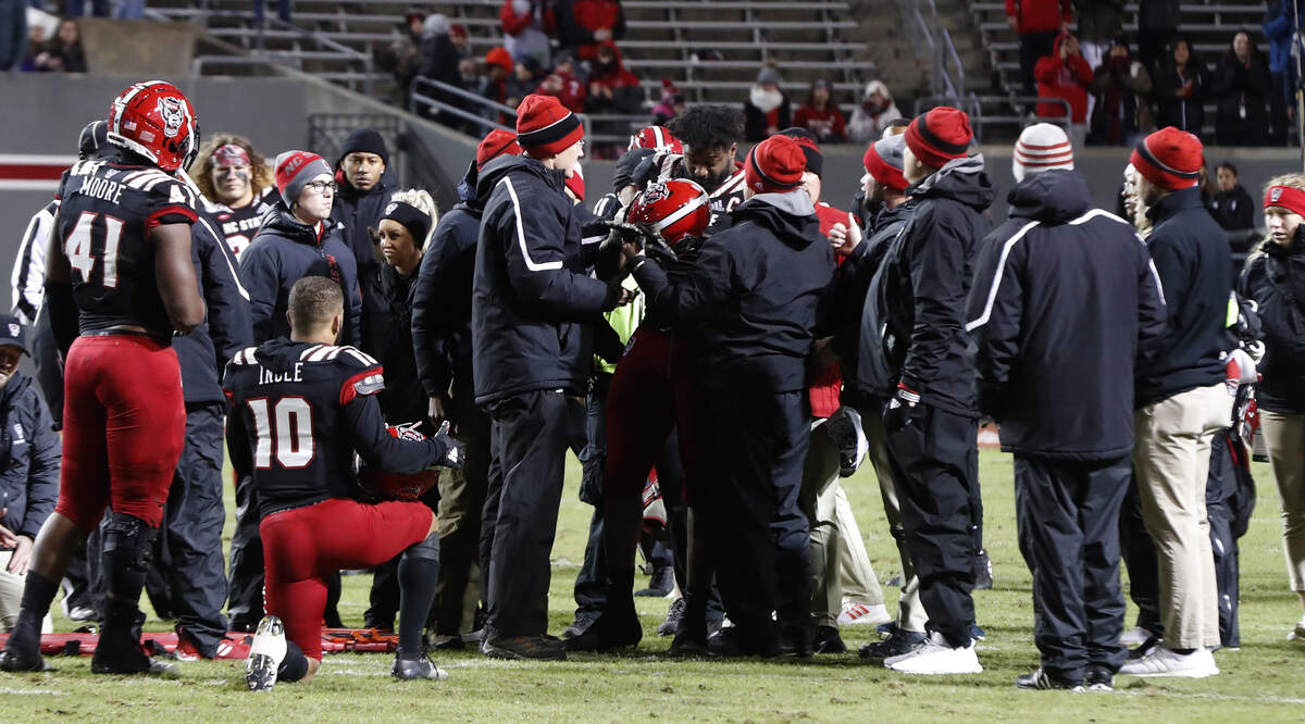 N.C. State defensive end James Smith-Williams (1) is helped up after he was injured during the second half of Louisville’s 34-20 victory over N.C. State at Carter-Finley Stadium in Raleigh, N.C., Saturday, November 16, 2019.