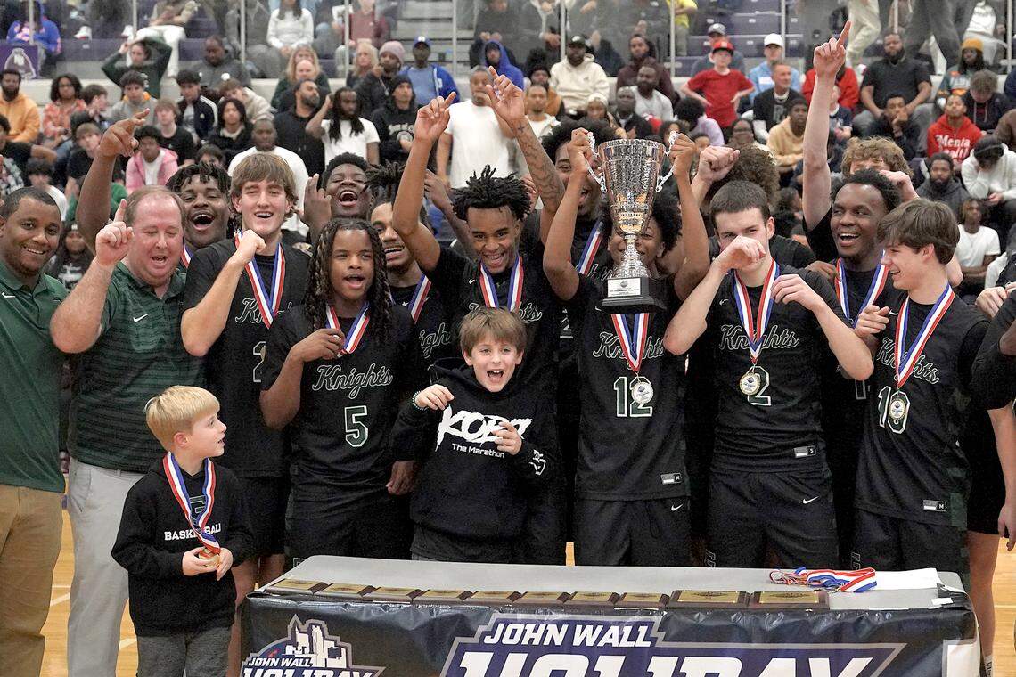 The Greenfield Knights celebrate with the Day'Ron Sharpe Bracket Championship trophy after their overtime victory over Coronado. The Greenfield Knights and the Coronado Cougars (Nevada) met in the finals of the Day'Ron Sharpe bracket of the  John Wall Holiday Tournament in Raleigh, N.C. on December 30, 2025.