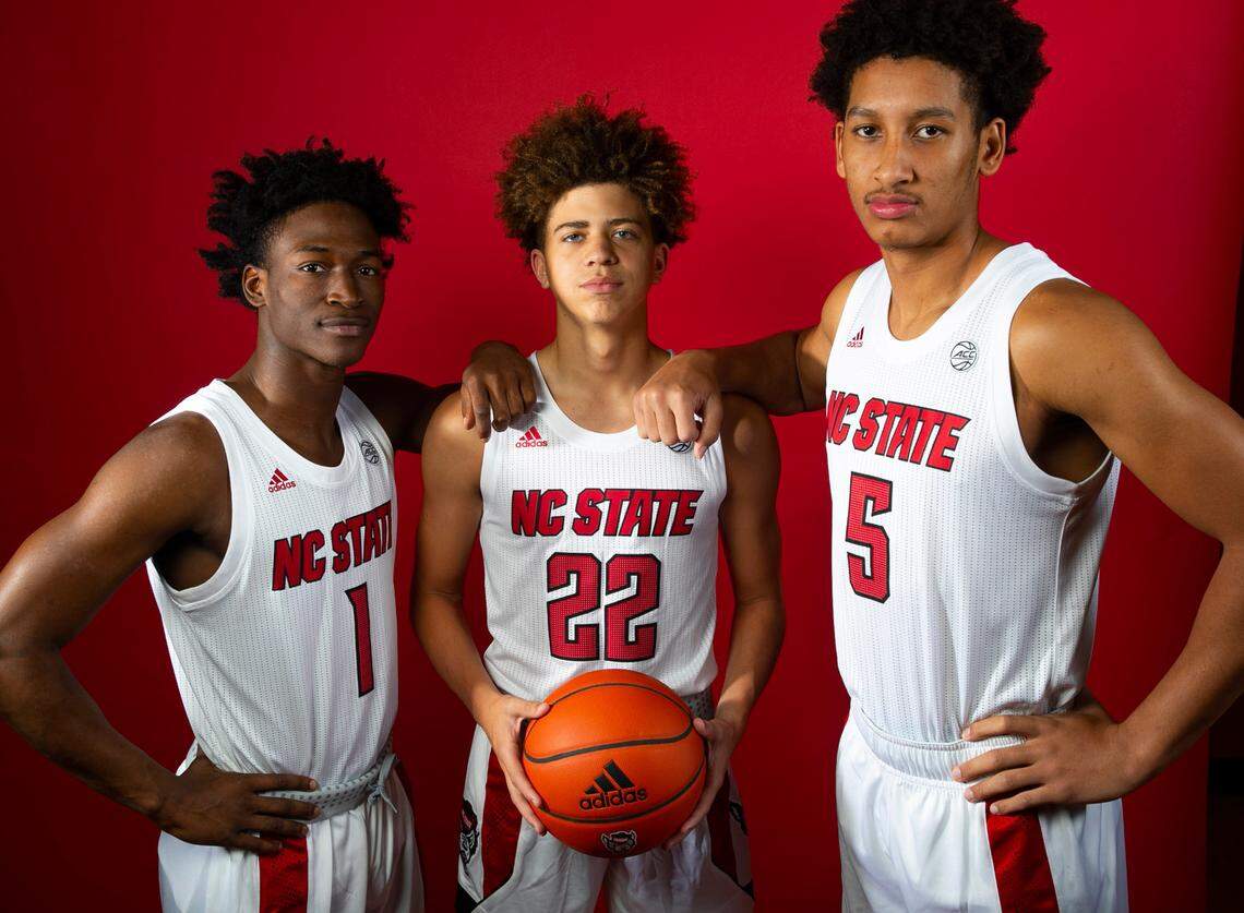 N.C. State’s Jarkel Joiner (1), Jordan Snell (22) and Jack Clark (5) pose for a portrait during the Wolfpack’s media day in Raleigh, N.C., Friday, Sept. 23, 2023.