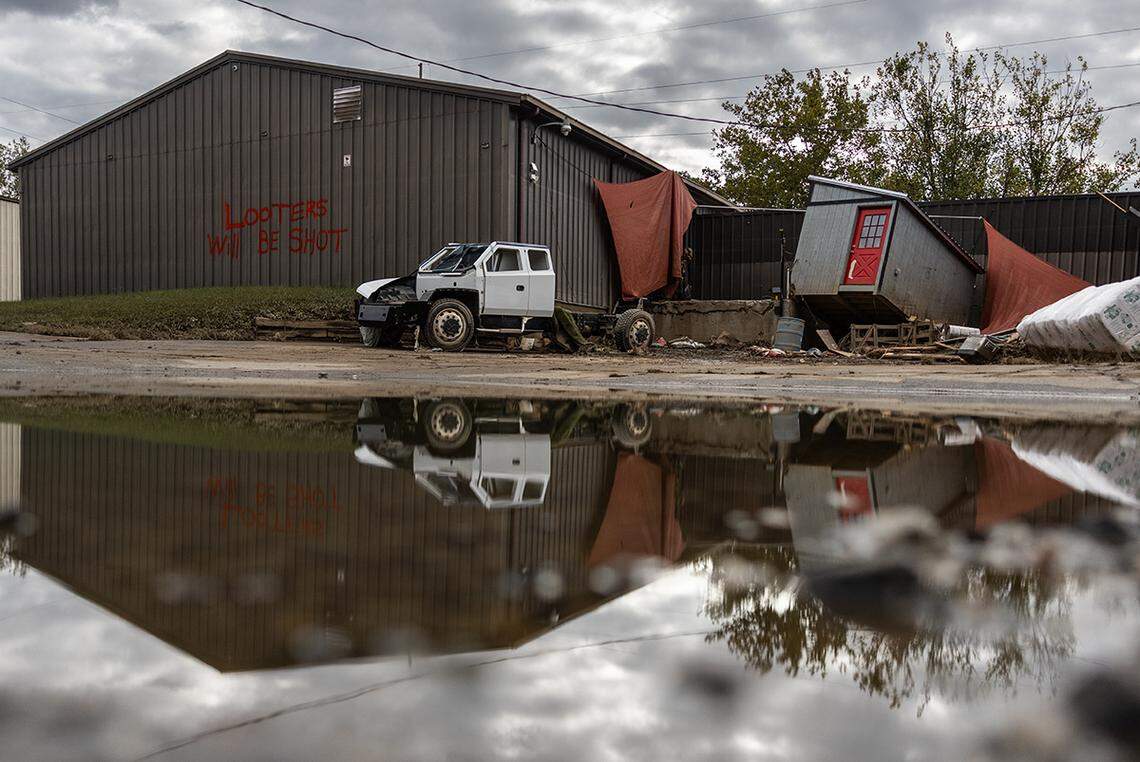 “LOOTERS WILL BE SHOT” is spray painted on a building on Riverside Drive in Asheville, N.C. on Tuesday, October 1, 2024.