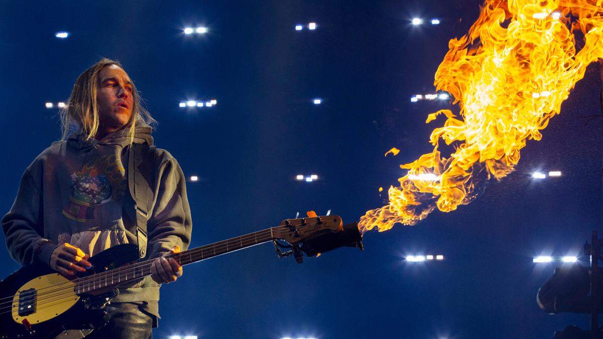Flames shoot from the guitar of Fall Out Boy bassist Pete Wentz during their concert at Raleigh, N.C.’s PNC Arena, Tuesday night, March 19, 2024.