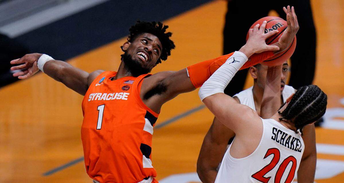 Syracuse forward Quincy Guerrier (1) fights for a rebound with San Diego State guard Jordan Schakel (20) during the first half of a college basketball game in the first round of the NCAA tournament at Hinkle Fieldhouse in Indianapolis, Friday, March 19, 2021. 