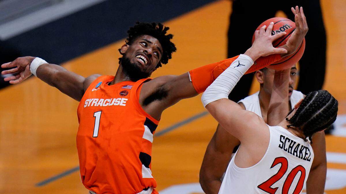Syracuse forward Quincy Guerrier (1) fights for a rebound with San Diego State guard Jordan Schakel (20) during the first half of a college basketball game in the first round of the NCAA tournament at Hinkle Fieldhouse in Indianapolis, Friday, March 19, 2021.
