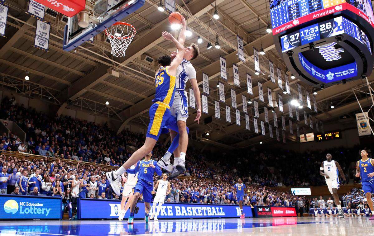 Duke’s Cooper Flagg (2) heads to slam in two as he is fouled by Pittsburgh’s Guillermo Diaz Graham (25) during Duke’s 76-47 victory over Pitt at Cameron Indoor Stadium in Durham, N.C., Tuesday, Jan. 7, 2025.