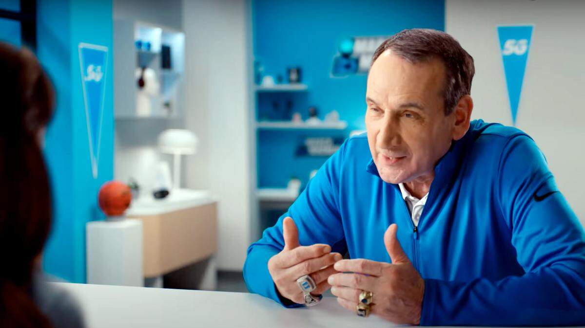 Duke coach Mike Krzyzewski appears with “Lily” in an AT&T commercial where he is applying for a job.