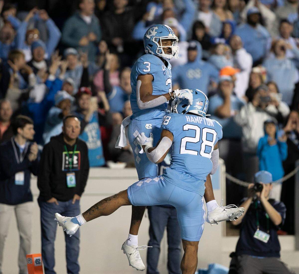 North Carolina’s Antoine Green (3) celebrates with Omarion Hampton (28) after a 16-yard pass from quarterback Drake Maye for a touchdown in the first quarter ahead of Pitt’s A.J. Woods (25) on Saturday, October 29, 2022 at Kenan Stadium in Chapel Hill, N.C.