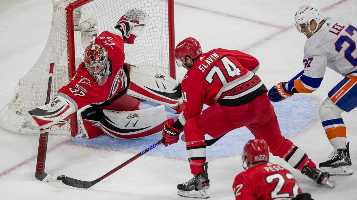 Carolina Hurricanes goalie Antii Raanta (32) stops a scoring attempt by New York Islanders’ Anders Lee (27) in the second period on Tuesday, April 17, 2023 at PNC Arena in Raleigh, N.C.